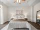 Inviting bedroom with a soft rug, stylish lighting, and a comfortable bed creating a restful retreat at 15496 W 66Th Dr # B, Arvada, CO 80007