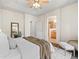 Bright, open bedroom featuring a plush bed, access to a bathroom, and a closet for optimal living at 15496 W 66Th Dr # B, Arvada, CO 80007