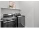 Laundry room with stacked washer and dryer at 15496 W 66Th Dr # B, Arvada, CO 80007
