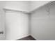 Walk-in closet features installed shelving racks and neutral colored carpeting at 15496 W 66Th Dr # B, Arvada, CO 80007