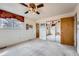 Spacious bedroom with a ceiling fan, neutral walls, carpet flooring, and a mirrored closet at 3245 S Nucla St, Aurora, CO 80013