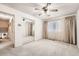 Clean bedroom with neutral carpet, large window, and a mirrored closet providing ample storage at 3245 S Nucla St, Aurora, CO 80013