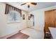 Bright bedroom with neutral walls, carpet, window with blinds and mirrored closet doors at 3245 S Nucla St, Aurora, CO 80013