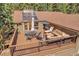 Relax on the elevated deck with a dining table and comfortable outdoor seating at 7753 Red Fox Dr, Evergreen, CO 80439