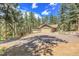 Spacious garage with upper deck, perfect for a workshop or recreational area at 7753 Red Fox Dr, Evergreen, CO 80439