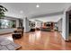 Spacious living room with hardwood floors, recessed lighting, and plentiful natural light from the large windows at 7753 Red Fox Dr, Evergreen, CO 80439