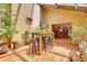 Spacious sunroom with open floor plan and a high top table with seating at 7753 Red Fox Dr, Evergreen, CO 80439