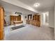 Finished basement with a bar area, pool table lighting, and wood furniture at 7809 S Flower St, Littleton, CO 80128