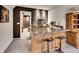 Basement bar area with custom-built seating and granite countertops at 7809 S Flower St, Littleton, CO 80128