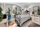 Eclectic bedroom with colorful accents, unique décor, and a large window at 7809 S Flower St, Littleton, CO 80128
