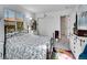 Cozy bedroom with a large window, decorative bed frame, and a closet at 7809 S Flower St, Littleton, CO 80128