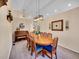 Elegant dining room with large wooden table and ornate décor at 7809 S Flower St, Littleton, CO 80128