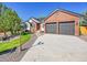 Charming two-story brick home with a well-maintained lawn and a two-car garage at 7809 S Flower St, Littleton, CO 80128