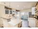 Bright kitchen with modern appliances, granite countertops, and a view of the outdoor patio at 8300 Fairmount Dr # M103, Denver, CO 80247