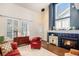 Inviting living room with fireplace, tall windows, and cozy furnishings, creating a warm atmosphere at 8300 Fairmount Dr # M103, Denver, CO 80247