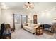 Inviting room with neutral carpet, a comfortable sofa, ample natural light, and a ceiling fan for added comfort at 8300 Fairmount Dr # M103, Denver, CO 80247