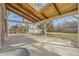 Covered patio with concrete flooring and a view of the backyard at 6800 S Bemis St, Littleton, CO 80120