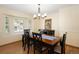 Comfortable dining room featuring wooden floors, a table with chairs, and natural lighting from the window at 1892 W Kettle Ave, Littleton, CO 80120
