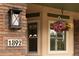 Close-up of the home's address number with a hanging floral arrangement at 1892 W Kettle Ave, Littleton, CO 80120