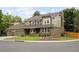 Beautiful green, brick home featuring lush landscaping and a well maintained yard at 1892 W Kettle Ave, Littleton, CO 80120