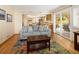 Open floor plan flows from living room to the kitchen and patio at 1892 W Kettle Ave, Littleton, CO 80120