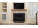 Close up on the fireplace, tv, and shutters in the living room at 1892 W Kettle Ave, Littleton, CO 80120