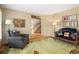 Comfortable living room with hardwood floors, a variety of stylish seating and neutral paint at 1892 W Kettle Ave, Littleton, CO 80120