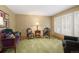 Cozy living room with large windows, plush seating, and neutral color scheme at 1892 W Kettle Ave, Littleton, CO 80120