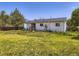 View of backyard featuring a well maintained lawn and a wood fence at 10895 Fairfax Way, Thornton, CO 80233