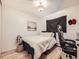 Cozy bedroom with a bed, neutral tones, and natural light creates a comfortable and inviting atmosphere at 10895 Fairfax Way, Thornton, CO 80233