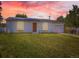 Charming single-story home featuring solar panels, a well-maintained lawn, and a welcoming front entrance at 10895 Fairfax Way, Thornton, CO 80233