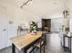 Bright living space with stylish furniture, wood-burning stove, and modern lighting at 10895 Fairfax Way, Thornton, CO 80233