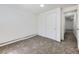 A simple room featuring neutral paint and carpet creating a clean and versatile space at 10895 Fairfax Way, Thornton, CO 80233