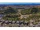 Scenic aerial view showcases the neighborhood, mountains, and winding roads at 744 Kryptonite Dr, Castle Rock, CO 80108