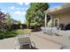 Backyard patio with a dining table and chairs, along with a charcoal grill at 744 Kryptonite Dr, Castle Rock, CO 80108