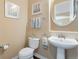 Charming half-bathroom with pedestal sink and tasteful decor at 744 Kryptonite Dr, Castle Rock, CO 80108