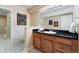 Bathroom featuring a marble-tiled floor, vanity with drawers, and framed artwork at 744 Kryptonite Dr, Castle Rock, CO 80108