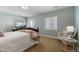 Inviting bedroom with warm carpet, light blue walls, and natural light at 744 Kryptonite Dr, Castle Rock, CO 80108