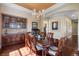 Formal dining room with chandelier, hardwood floors, and elegant furniture at 744 Kryptonite Dr, Castle Rock, CO 80108