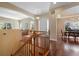 Inviting entryway with hardwood floors and staircase leading to the upper level at 744 Kryptonite Dr, Castle Rock, CO 80108