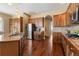 Spacious kitchen with granite countertops, stainless steel appliances, and beautiful wood cabinetry at 744 Kryptonite Dr, Castle Rock, CO 80108