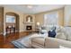 Cozy living room featuring a fireplace, plush seating, and ample natural light at 744 Kryptonite Dr, Castle Rock, CO 80108