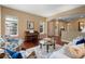 Elegant living room featuring hardwood floors and three windows offering natural light at 744 Kryptonite Dr, Castle Rock, CO 80108