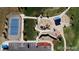 Aerial view of the neighborhood park featuring a tennis court and playground at 744 Kryptonite Dr, Castle Rock, CO 80108