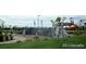 Community playground with climbing structure and play areas at 744 Kryptonite Dr, Castle Rock, CO 80108