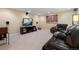 Cozy home theater featuring reclining leather seating, TV, and speaker system at 744 Kryptonite Dr, Castle Rock, CO 80108
