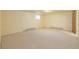 Basement featuring carpeted flooring, light yellow walls, and radiator at 833 Applewood Dr, Lafayette, CO 80026