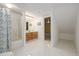 Basement bathroom with tile flooring, a shower, and double vanity at 833 Applewood Dr, Lafayette, CO 80026