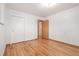 Bedroom with gleaming hardwood floors and closet space at 833 Applewood Dr, Lafayette, CO 80026