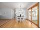 Bright dining room featuring hardwood floors, table, chairs, and slider to patio at 833 Applewood Dr, Lafayette, CO 80026